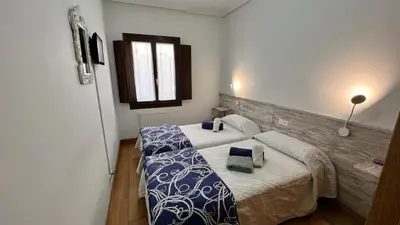Cama o camas de una habitación en Pensión Buen Camino