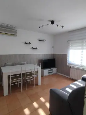 Una televisión o centro de entretenimiento en Casa Manzana