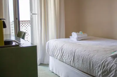 Cama o camas de una habitación en Hostal Navarra