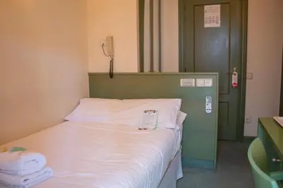 Cama o camas de una habitación en Hostal Navarra