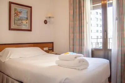 Cama o camas de una habitación en Hostal Navarra