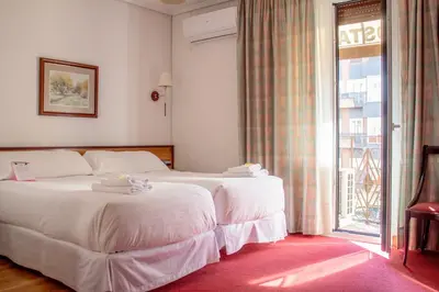 Cama o camas de una habitación en Hostal Navarra
