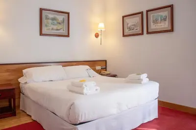 Cama o camas de una habitación en Hostal Navarra