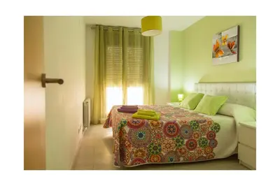 Cama o camas de una habitación en Apartamentos Mayoral
