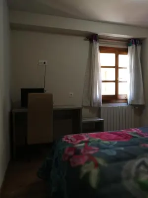 Cama o camas de una habitación en Hostal Casa Lacreu