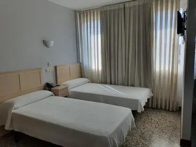 Cama o camas de una habitación en Hotel Cogullada