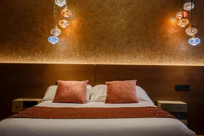 Cama o camas de una habitación en Hostal Rodas Pamplona