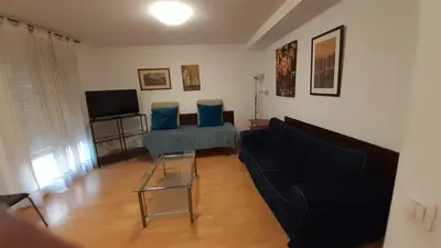 Una televisión o centro de entretenimiento en Apartamentos Auhabitat Zaragoza, edificio de apartamentos turísticos