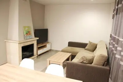 Una televisión o centro de entretenimiento en Apartamentos Naspún