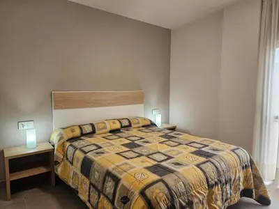 Cama o camas de una habitación en Apartamentos Naspún