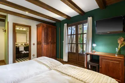 Cama o camas de una habitación en Hotel Rural El Mirador de los Pirineos