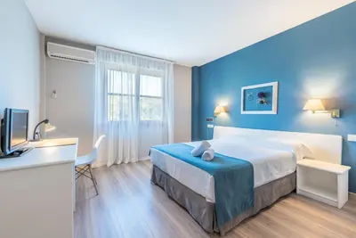 Cama o camas de una habitación en Hotel Jakue