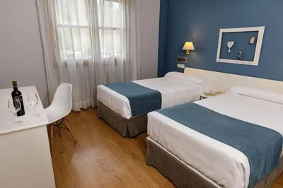 Cama o camas de una habitación en Hotel Jakue