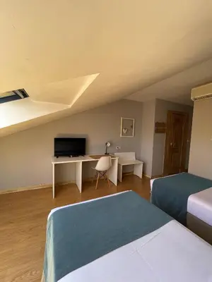 Cama o camas de una habitación en Hotel Jakue