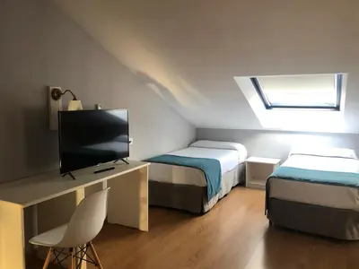 Cama o camas de una habitación en Hotel Jakue