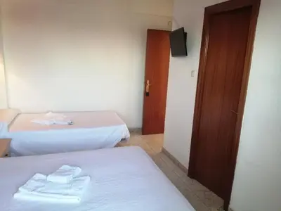 Cama o camas de una habitación en Hostal Jaime I