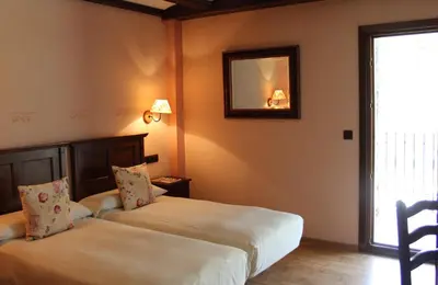 Cama o camas de una habitación en Hotel Casa Arcas