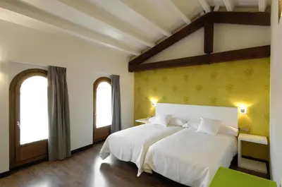 Cama o camas de una habitación en Hotel Cienbalcones