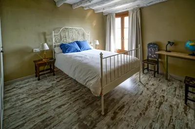 Cama o camas de una habitación en Casa Rustíca Cal Mian