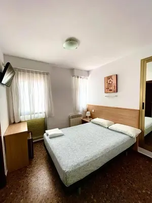 Cama o camas de una habitación en Hostal Milmarcos