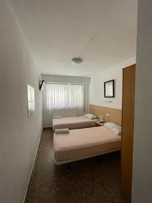 Cama o camas de una habitación en Hostal Milmarcos