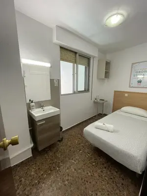 Cama o camas de una habitación en Hostal Milmarcos