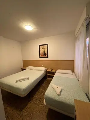 Cama o camas de una habitación en Hostal Milmarcos
