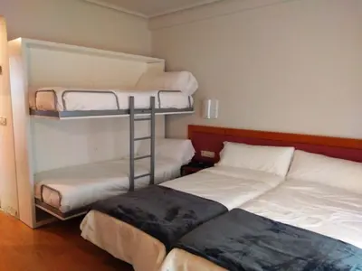 Cama o camas de una habitación en Hotel Brujas De Irues