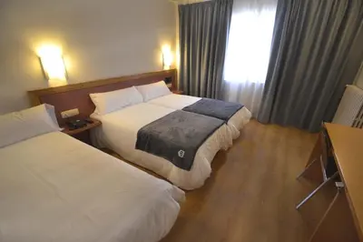 Cama o camas de una habitación en Hotel Brujas De Irues