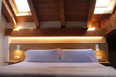 Cama o camas de una habitación en Hotel Saurat