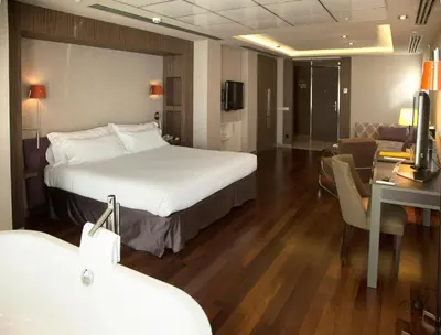 Cama o camas de una habitación en Hotel Alfonso