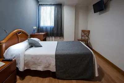 Cama o camas de una habitación en Iraipe Izaga Hostal