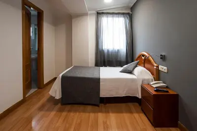 Cama o camas de una habitación en Iraipe Izaga Hostal