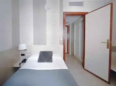 Cama o camas de una habitación en Hotel Rio Arga