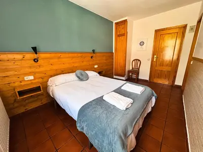 Cama o camas de una habitación en Hotel de Montaña Uson