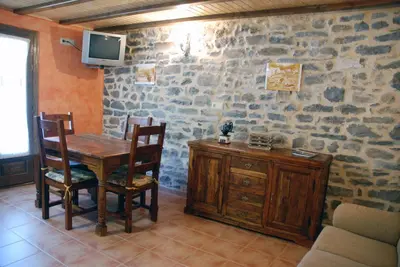Una televisión o centro de entretenimiento en Apartamento el Patio Casa Cajal