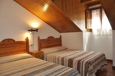 Cama o camas de una habitación en Hotel Castillo d'Acher