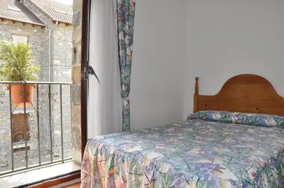 Cama o camas de una habitación en Hotel Castillo d'Acher