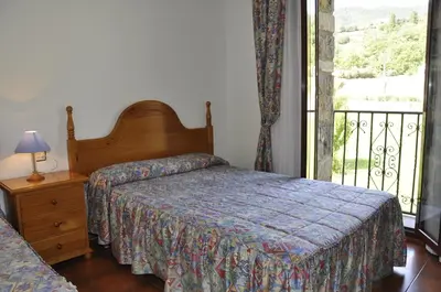 Cama o camas de una habitación en Hotel Castillo d'Acher