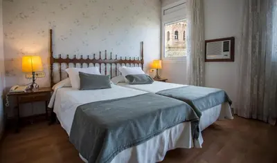 Cama o camas de una habitación en Hotel Segle XX