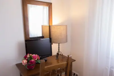 Una televisión o centro de entretenimiento en Hotel Segle XX