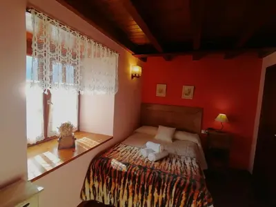 Cama o camas de una habitación en casa rural Dera Hont