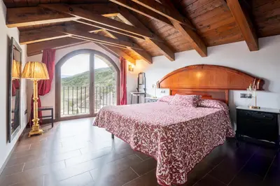 Cama o camas de una habitación en Casa Dieste Apartamentos Turísticos en Boltaña