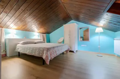 Cama o camas de una habitación en Casa Dieste Apartamentos Turísticos en Boltaña