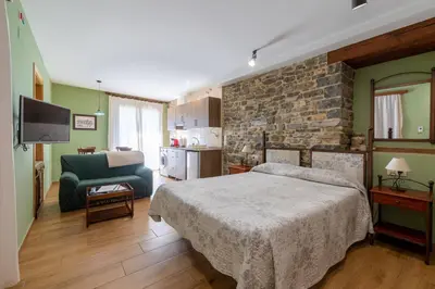 Cama o camas de una habitación en Casa Dieste Apartamentos Turísticos en Boltaña