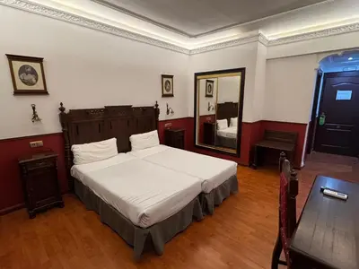 Cama o camas de una habitación en Hotel El Cisne