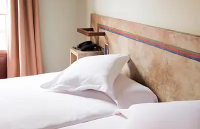 Cama o camas de una habitación en Hospedium Hotel Posada De La Luna