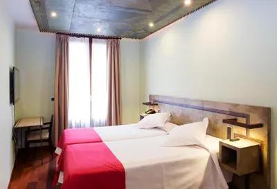 Cama o camas de una habitación en Hospedium Hotel Posada De La Luna