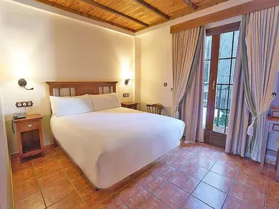 Cama o camas de una habitación en Hotel Bocalé 3000