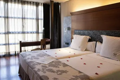 Cama o camas de una habitación en Hotel Sancho Abarca Petit SPA